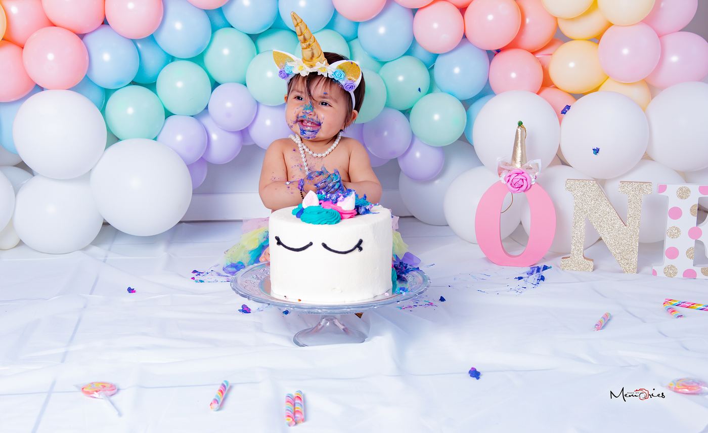 Child birthday session with balloons and cake
