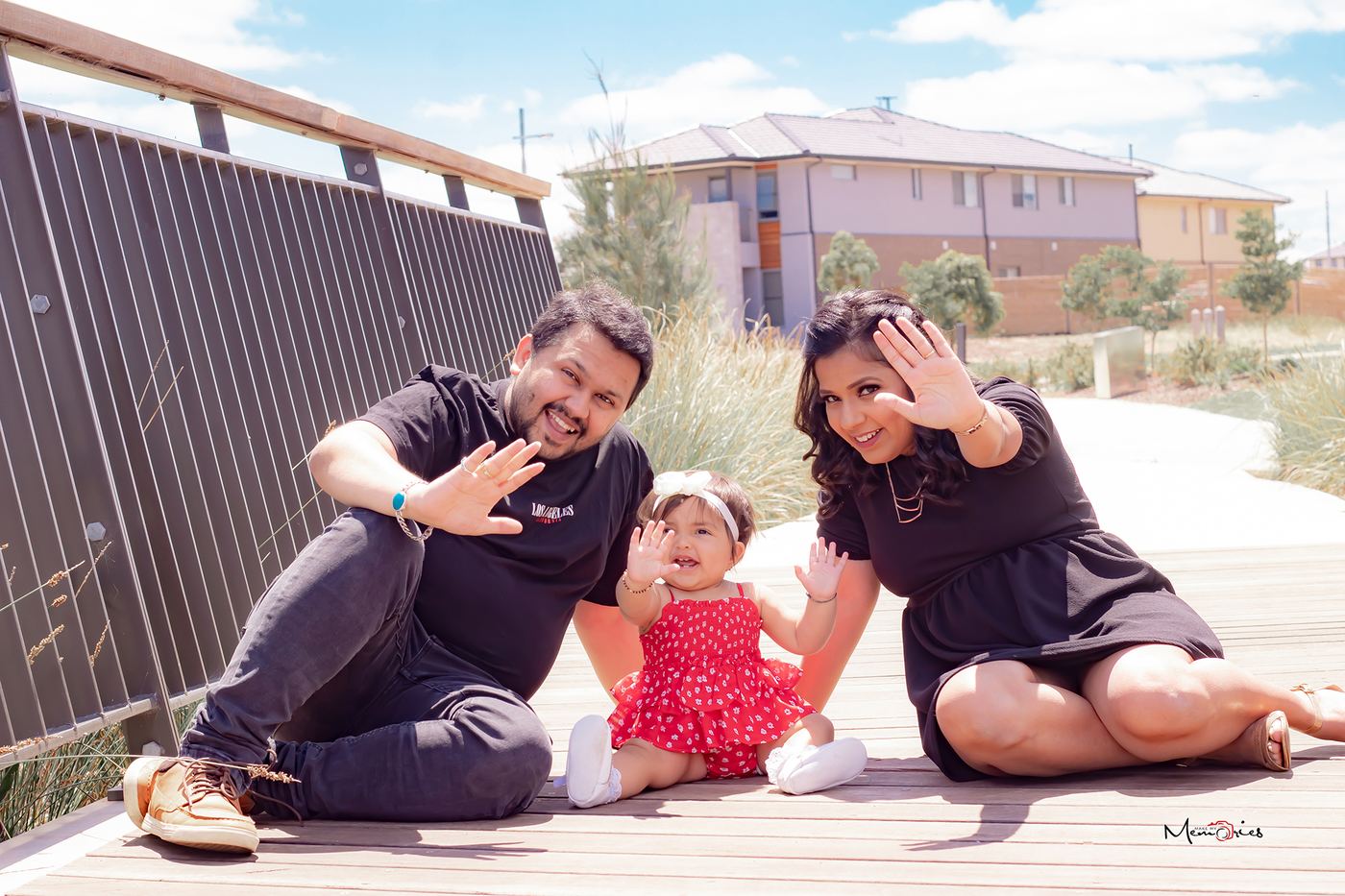 Family sitting together outside in bright daylight