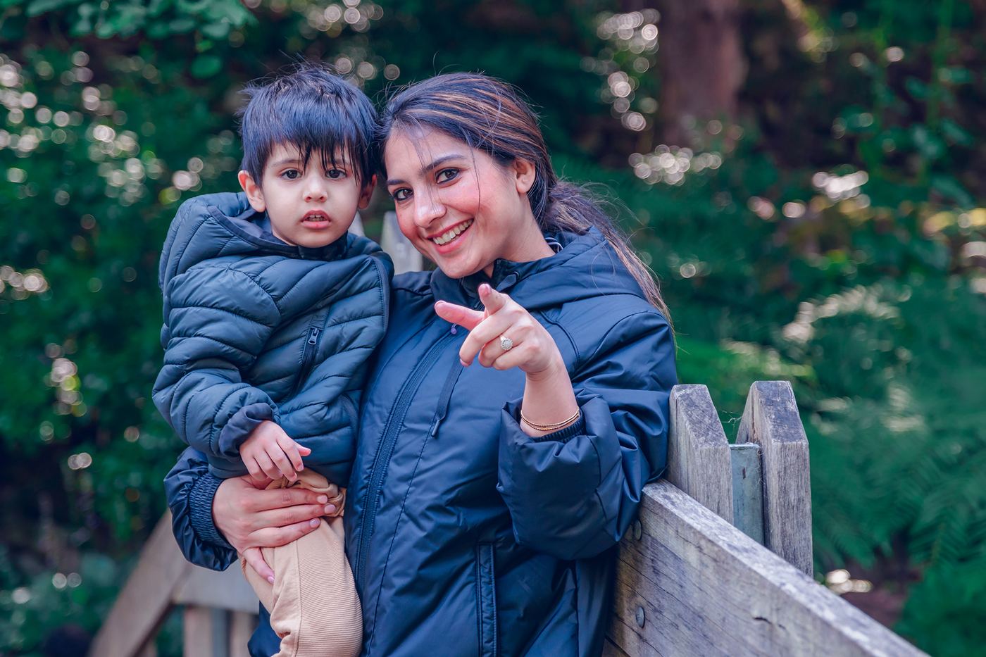 Mother and child portrait in greenery
