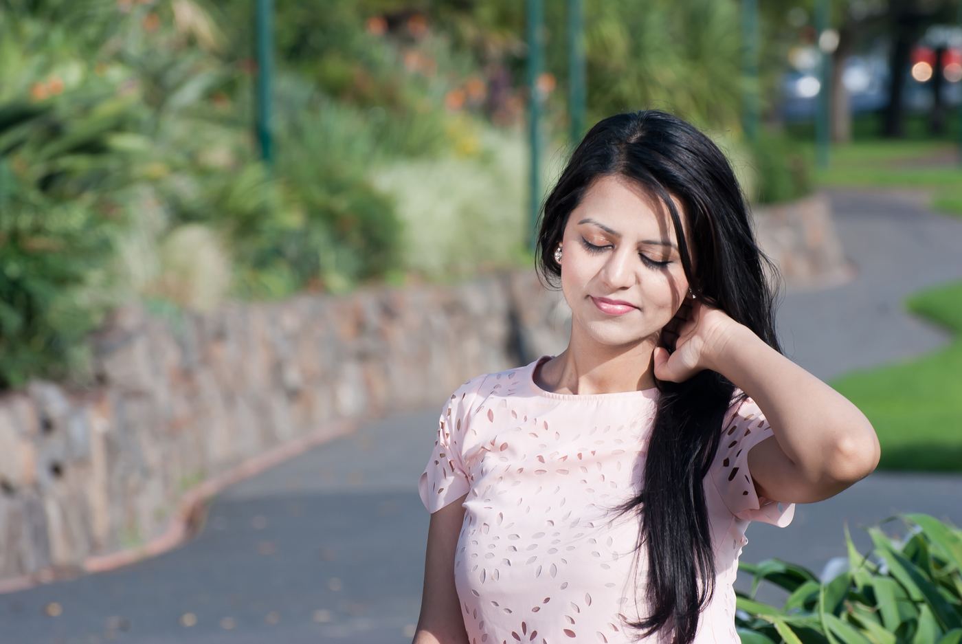 Outdoor personal portrait with soft garden background