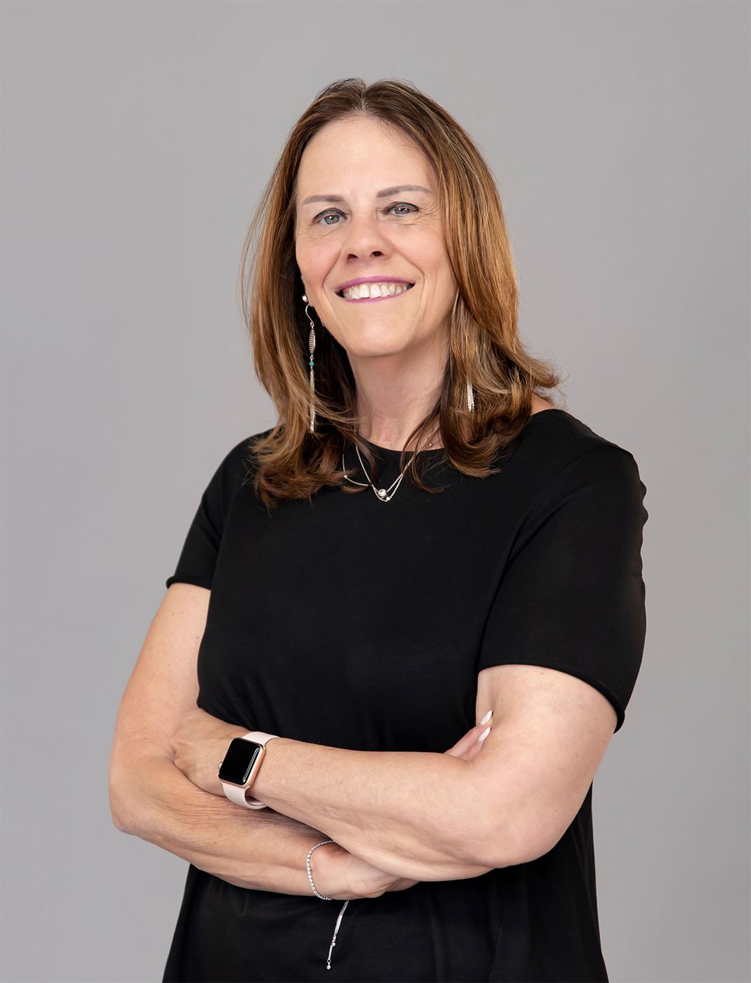 Professional portrait against a neutral studio background